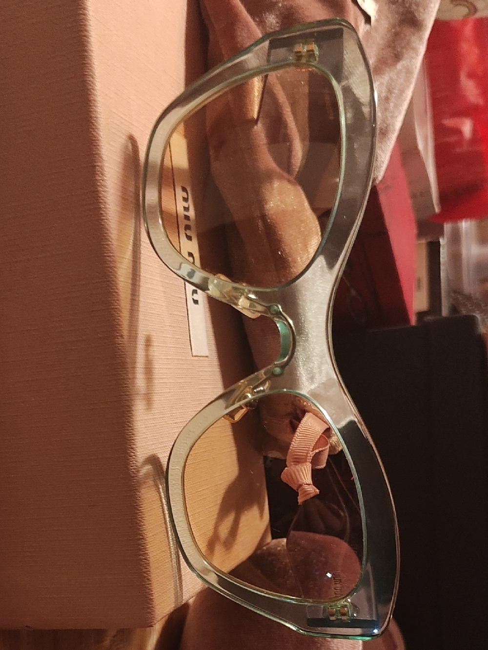 Miu Miu Translucent Light Green Cat-Eye Sunglasses with Gold Accents SMU M1 1p
